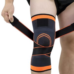 Putting on a knee brace by bringing the straps around to fix at the front (kneecap)